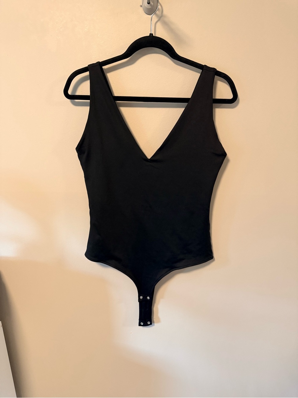 ReoRia Black V-Neck One-Piece Bodysuit